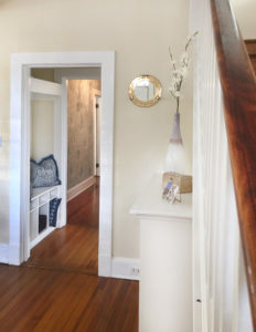 Home Staging Downtown Annapolis, foyer decorated with accents, pillows and a mirror