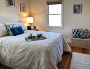 Home st.aging at Eastport. Master bedroom with blue accents